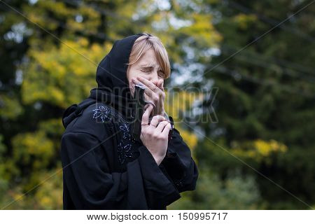 Muslim Woman With Arms In Autumn Day
