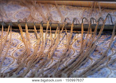 Preparing a loom before starting to make carpets. Warm light