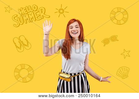 Hello Summer. Cheerful Emotional Young Teacher Smiling And Waving Her Hand While Greeting Summer