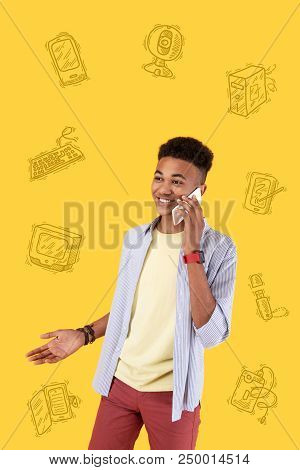 Phone Call. Positive Young Boy Feeling Satisfied With His New Device And Smiling While Talking On Th