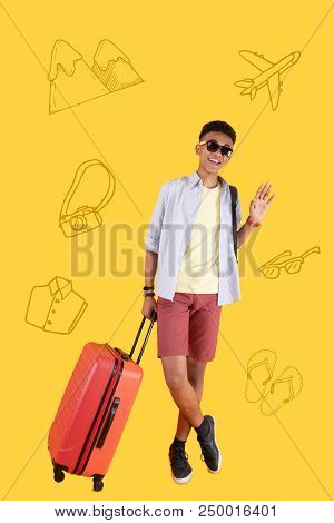 Goodbye Motherland. Cheerful Confident Student Saying Goodbye To His Motherland And Standing With A 