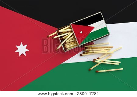 Jordan Flag  Is Shown On An Open Matchbox, From Which Several Matches Fall And Lies On A Large Flag.