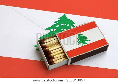 Lebanon Flag  Is Shown In An Open Matchbox, Which Is Filled With Matches And Lies On A Large Flag.