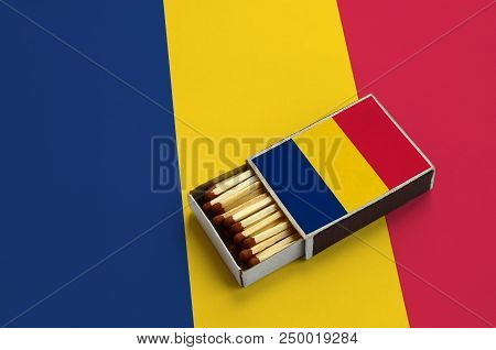 Chad Flag  Is Shown In An Open Matchbox, Which Is Filled With Matches And Lies On A Large Flag.