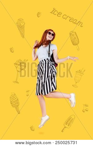 Jumping High. Positive Emotional Person Dreaming About Eating Her Favorite Delicious Ice-cream And F