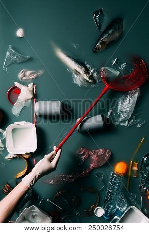 Cropped Shot Of Person In Latex Glove With Butterfly Net Cleaning Water From Rubbish