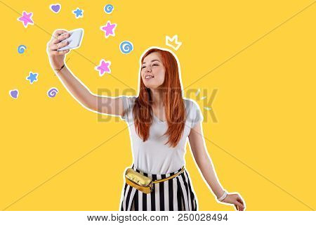 Lovely Selfie. Positive Young Person Smiling And Taking Selfies While Being Alone