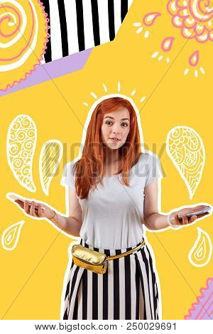 How To Choose. Beautiful Young Girl Standing With Two Smartphones In Her Hands And Shrugging Shoulde