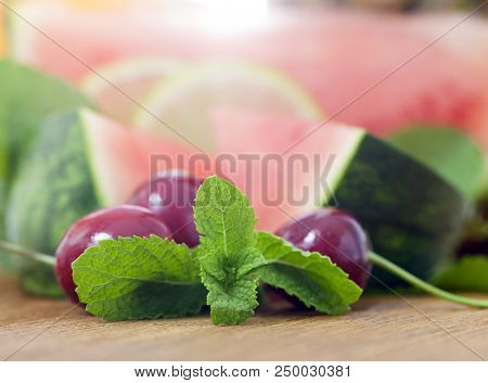 Lying Together An Orange, Watermelon, Pineapple, Cherry And Mint, Cut Into Pieces During Cooking. Ph