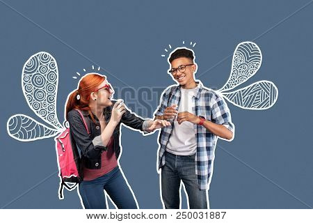 Having Fun. Positive Emotional Students Wearing Casual Clothes And Laughing While Having Fun Togethe