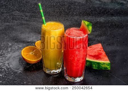 Two Lemonades From Orange And Watermelon Shot Close-up