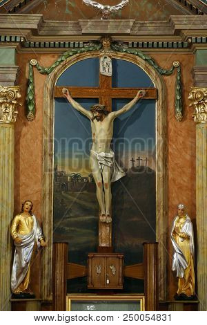 ZACRETJE, CROATIA - AUGUST 06: Crucifixion, altarpiece in the Parish Church of the Holy Cross in Zacretje, Croatia on August 06, 2017.