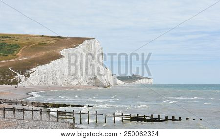 The White, Chalk Cliffs Of Haven Brow And The Seven Sisters From The Beach At Cuckmere Haven In East