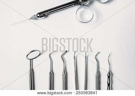 Dental And Endodontic Restoration Instruments On A White Background. Top View