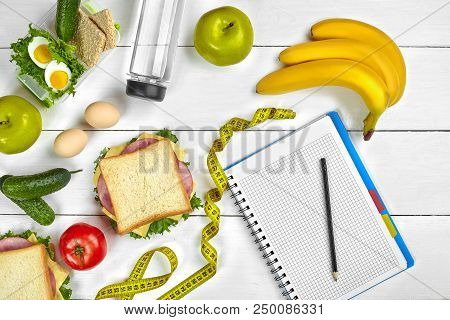 Top View Planning Notebook With Copy Space And Healthy Breakfast. Sandwich With Ham And Cheese, Eggs