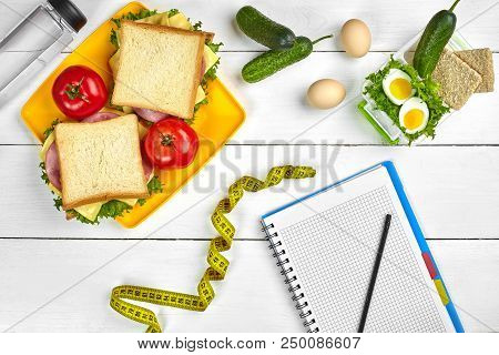 Top View Planning Notebook With Copy Space And Healthy Breakfast. Sandwich With Ham And Cheese, Eggs