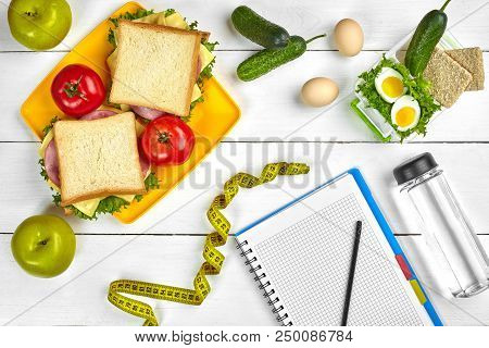 Top View Planning Notebook With Copy Space And Healthy Breakfast. Sandwich With Ham And Cheese, Eggs