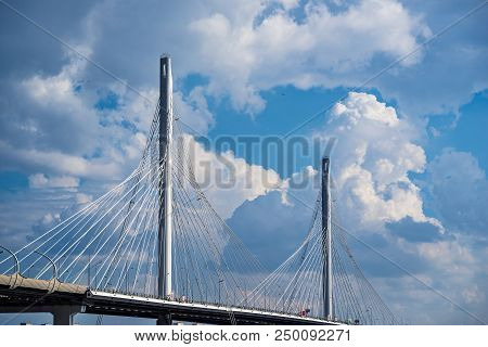 The Big And Modern Cable-stayed Bridge In St. Petersburg Against The Background Of The Cloudy Sky