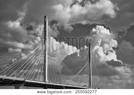 The Big And Modern Cable-stayed Bridge In St. Petersburg Against The Background Of The Cloudy Sky Mo