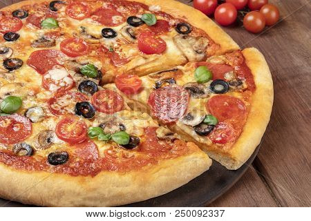 A Photo Of A Pepperoni Pizza On A Pizza Stone, On A Dark Rustic Background, A Closeup Of A Slice