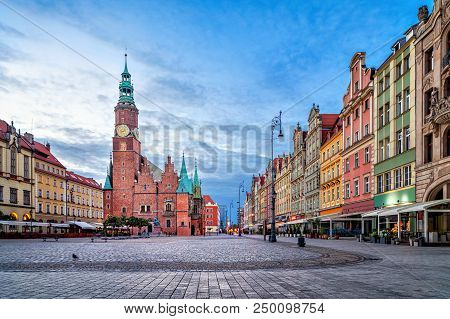 Colorful Houses And Historic Town Hall Building On Rynek Square At Dusk In Wroclaw, Poland