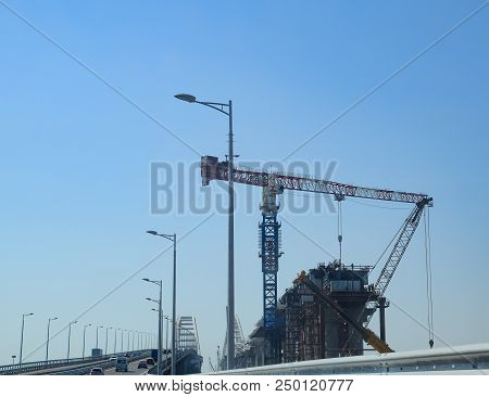 Crimean Bridge, Taman, Russia - July 9, 2018: Construction Of The Crimean Bridge. Lift Cranes And Ra