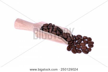 Coffee Beans And Wooden Scoop Isolated On White