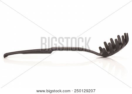 One Whole Kitchen Tool Black Plastic Spaghetti Spoon Isolated On White