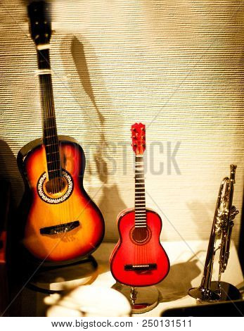Miniature Musical Instruments. Guitars And Trompet. No People