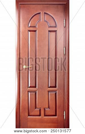 Wooden Interior Carved Door In A Door Frame Made Of Cherry Tree With A Brass Handle With Geometric O