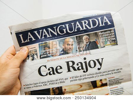 Barcelona, Spain - June 6 2018: Man Holding La Vanguardia Newspaper Cover With Cae Rajoy Translated 