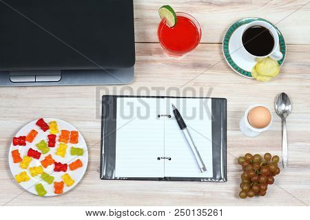 Designer Breakfast And Empty Notepad.  Cup Of Coffee, Juice, Crispy Potato Chips, Glasses Case, Note