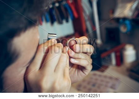 Different Goldsmiths Tools On The Jewelry Workplace. Jeweler At Work In Jewelry. Desktop For Craft J