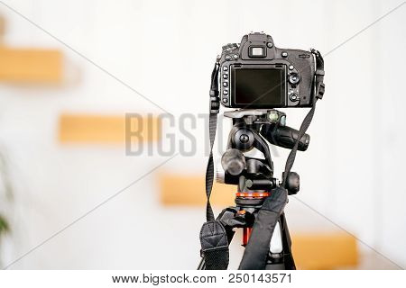 Professional Dslr Camera Standing On Tripod And Taking Interior Design Photos