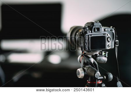 Professional Photographer Taking Indoor Pictures Of Newly Renovated Office. Camera On Tripod Details