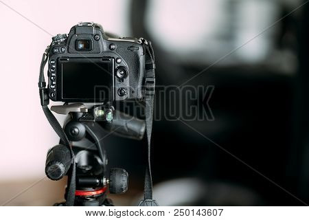 Professional Camera Standing On Tripod, Photographing And Working With Camera Stand
