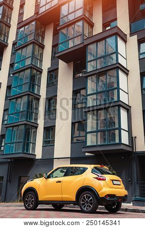 New Multi-storey Residential Building With Car Parked In Front. Modern Archicture