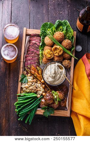 A Box With Falafel, Meat, Assorted Vegetables And Dip. Arabian Style. Top View.