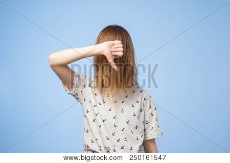 European Woman Shows Disapproval Sign, Gives Thumb Down Gesture, Dislikes Something, Has Disgusting 