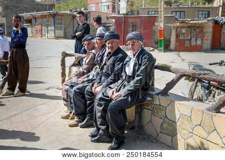 Marivan, Kurdistan, Iran - April 6, 2018: Kurdish Elderly Men In Darreh Tafi Village Near Zarivar La