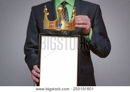 Winner Blank Diploma Or Certificate Mockup In Businessman Hand. Man Is Holding A Blank Photo Frame W