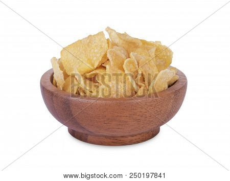 Breakfast Cereal Cornflakes In Wooden Bowl Isolated On White Background.