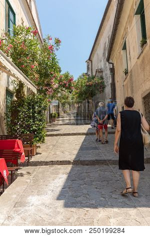 Ravello, Italy - June 16, 2017: A Narrow Steep Street With Blooming Oleanders In Ravello. Amalfi Coa