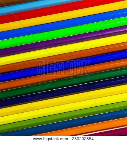 Colored Wooden Pencils Of Different Colors In The Background