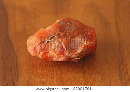 Carnelian Raw Untreated Natural Stone Mineral, A Collection Of Natural Stones On A Background Of Nat