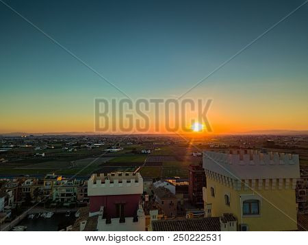 View From The Air To The Agrarian Fields During A Bright Sunset Near The Bays Of Port Saplaya. Valen