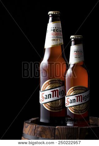London, Uk - April 27, 2018: Bottles Of San Miguel Lager Beer On Top Of Old Wooden Barrel. The San M