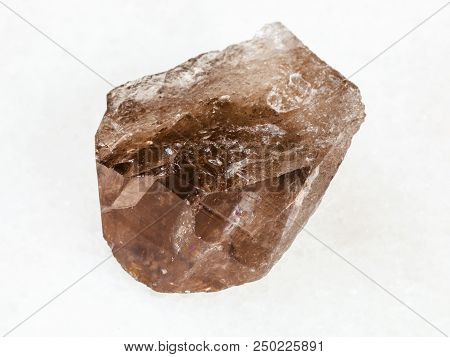 Macro Shooting Of Natural Mineral - Smoky Quartz Crystal On White Marble From Ural Mountains