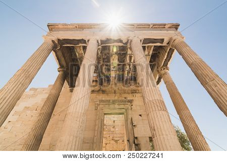 Ruins Of Old Temple Of Athena Polias Near Parthenon Temple On The Acropolis Of Athens, Greece. Direc