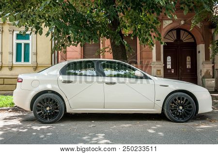 Novi Sad, Serbia. July - 15. 2018. White Alfa Romeo 159 Car With Black Alloy Wheels Parked On The St